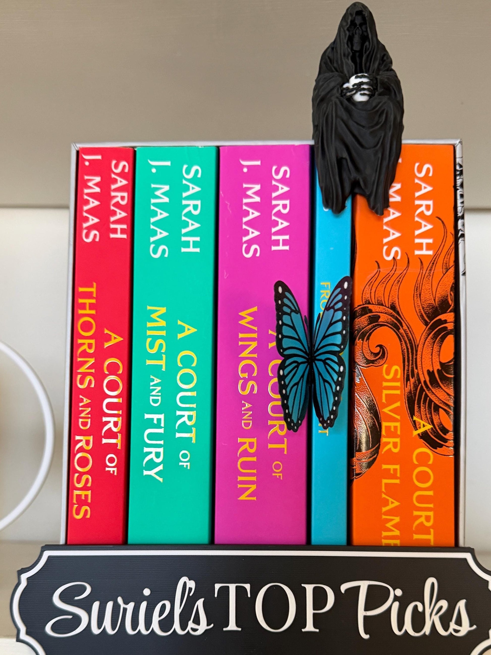 ACOTAR inspired Suriel with tea mug 3d printed shelf sitter, as seen in black and white color option.