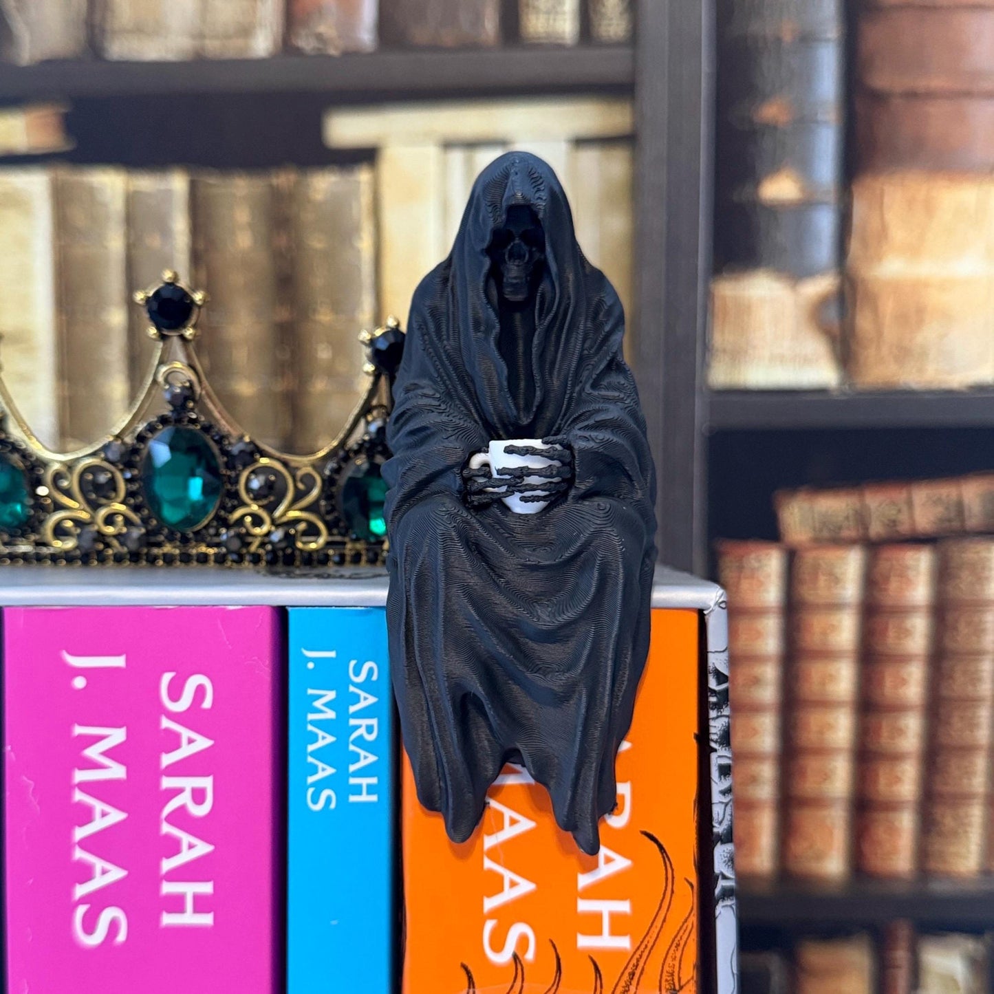 ACOTAR inspired Suriel with tea mug 3d printed shelf sitter, as seen in black and white color option.